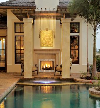 WATERWORKS: A curtain of water from the top of a trellised roof (left) encloses the master suite terrace, partially obscuring a propane fireplace while adding one of several dramatic effects to the pool and spa.