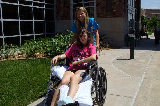 Emily Huddleston leaves the hospital after multiple surgeries and post-operative treatment for a severe wound to her leg, suffered during the tornado.