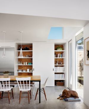 Sliding doors can make for hidden pantry storage space or open shelving.