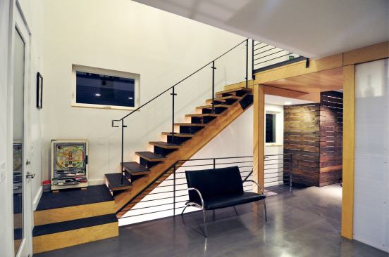 Just like the kitchen countertops, the stair treads are topped in a meterial made from recycled paper, but in a darker hue.