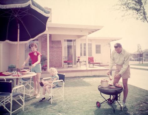 Family barbecue in Lakewood Plaza surburban development, circa 1950, Long Beach, California; Architect: Chris Choate with designer Cliff May