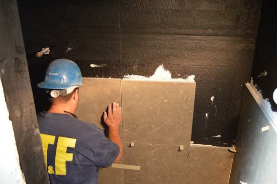 Large-format tiles are installed in the bathroom.