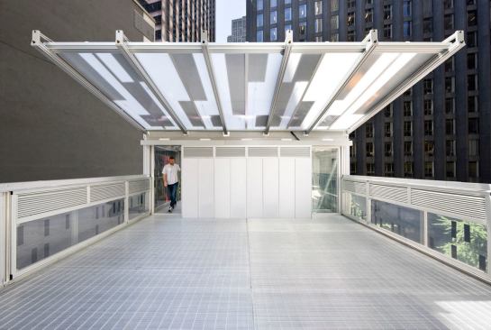 Photovoltaic cells are located on the roof deck canopy, and the SmartWrap™ wall cavity is vented along the side railings.