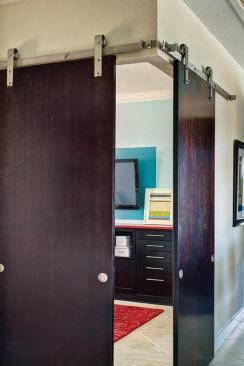 Sliding doors set at a 90-degree angle offer an updated take on the traditional French door style enclosure, without sacrificing the ability to open the space up to the rest of the home. Project: Builder 2012 Concept Home, Orlando, Fla.; Architects: Canin Associates, Orlando; Woodley Architectural Group, Denver; Builder: Centerline Homes, Coral Springs, Fla.