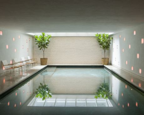 A classic modernist single-family house in Manhattan’s Carnegie Hill contains one of the ultimate New York City luxuries—a pool in the basement, illuminated by a skylight. Project: Upper East Side Townhouse, New York; Builder: Chilmark Builders, Pleasantville, N.Y.; Architect: Lichten Craig Architects, New York