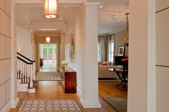 A badly-done 1960s remodel had closed off the home's center hall. Now, there's a beautiful view through the house to the rear garden.
