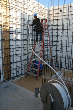 Steady Flow: Radiant heating and cooling tubing, filled with a water/antifreeze mixture, is embedded in the wall system.