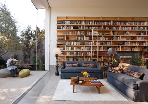 The wall of books in this Venice, Calif., house creates a visual balance with the view to the garden outside.