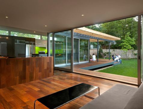 New open living spaces enjoy close connections to the back yard.