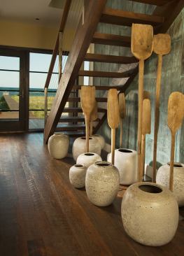 The interior of the house is filled with touches that honor Cape Cod’s seafaring past. In the foyer is a wall of copper, a material that was once commonly used for joinery in boat-building.