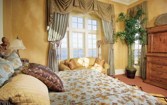 PRIVATE PEEK: Framed by a trio of windows, the inspuring lake view from the pavilion-like master bedroom is almost a secret among the owners, reserved only for them and without intrusion from any activity other than the water's whims.