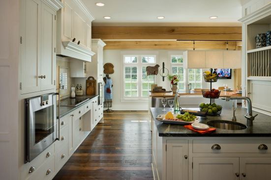 Two islands with ample turning space in-between give the homeowners more work surfaces and plenty of low storage, which is easier to reach from a wheelchair.