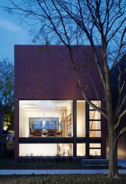 A fresh response to a typical Chicago neighborhood lot, this house embraces a startling simplicity and openness. Main-floor functions occupy a single glass-ended space.