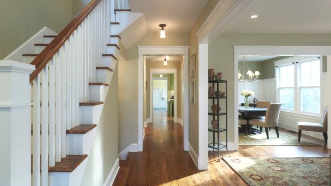 The home's traditional interiors remain, but they've been opened up. Stairs were rebuilt (knocking out the hall bathroom on the second floor made more room), and the core plan was maintained.