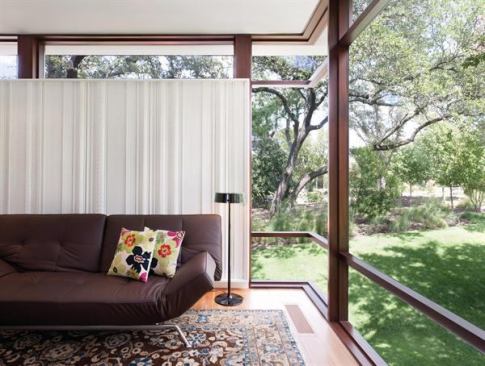 A beautifully crafted corner window offers this indoor living room the feeling of being out in nature. Project: Lakeview Residence, Austin, Texas; Architect: alterstudio, Austin