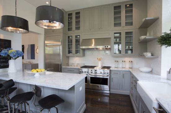 Kitchens offer plenty of storage with ceiling-height cabinets and open shelving.