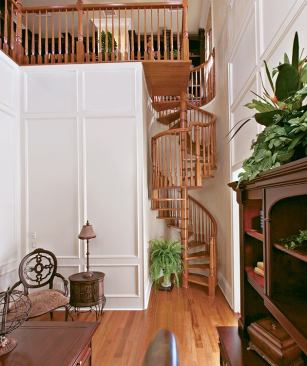 BETWEEN JOBS: Set smartly between the parlor and the master suite, with access to the nearby powder room, its own entry, and a private library above, the home office is designed to suit the needs of a home-based business or a telecommuting executive. It also suggests a sitting room for the master suite upon retirement.