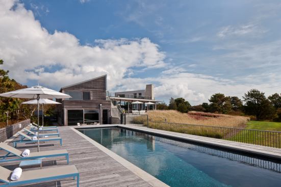 Views of scrub, bayberry, oaks, and finally the ocean are seen from this south-facing pool, which sits at a lower level than the rest of the house. Project: Up Over Between House, Martha’s Vineyard, Mass.; Builder: Martha’s Vineyard Construction Co., West Tisbury, Mass.; Architect: Hutker Architects, Vineyard Haven, Mass.; Landscape Architect: Horiuchi Solien Landscape Architects, Falmouth, Mass