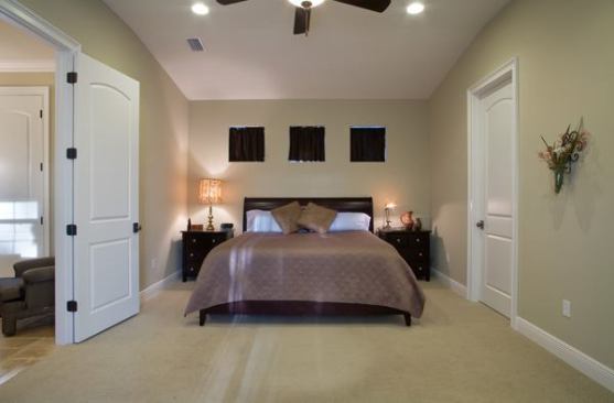 The bedroom is lit with energy-efficient compact flouresscent bulbs.
