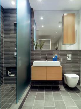 Floating cabinetry and fittings present a streamlined look in the bath.