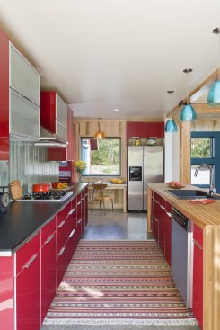 The slab-on-grade construction has simple concrete floors that are warmed by radiant heat. 