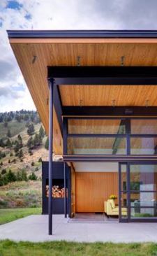 Mixed-grain fir on the underside of roof overhangs helps reinforce this open, casual home’s strong connection to the outdoors. Location: Big Sky, Mont.; Architect: Balance Associates