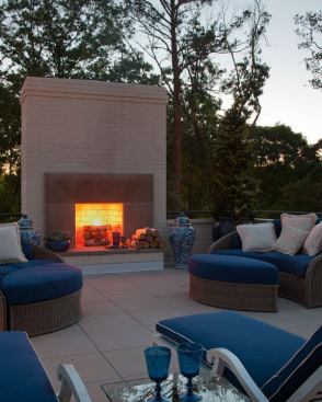 A sitting area mimics a welcoming interior fireside, but with plenty of space to embrace being outside.  Architect: William T. Baker; Builder: Warren Sirzyk, Renaissance Development Corp.; Landscape Architect: Joe Gayle, Joe Gayle and Associates
