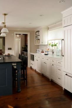 Designers say more homeowners are opting for wood floors in the kitchen.