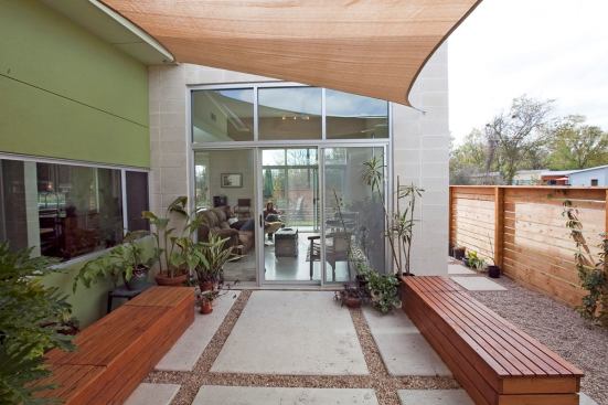 The home's plan creates multiple outdoor spaces, including this main courtyard between the living room and master bedroom.