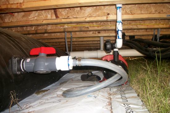 The house’s rainwater catchment system that has the capacity to store up to 1,000 gallons of water.