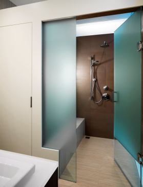 The master bath has a spalike elegance and is artfully “hidden” behind door No. 3 among the closets.   2011 Remodeling Design Awards (September)  Whole-House Remodeling $250,000 – $500,000  Kube Architecture, Washington, D.C.