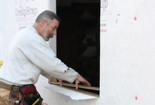 Slope the SillI fasten a piece of beveled siding to the rough sill, with the thick edge toward the interior, to direct moisture outside.