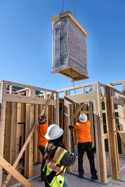 A Katerra Bath Kit is moved into place at the K90 building. The Bath Kit is designed to be assembled in less than a day by only two people.