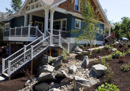 The newly planted raingarden on the side of the house colllects and filters stormwater runoff.