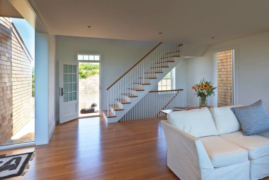 A Shaker-like stairway exemplifies the building’s fusion of minimalist traditionalism and classical modernism.