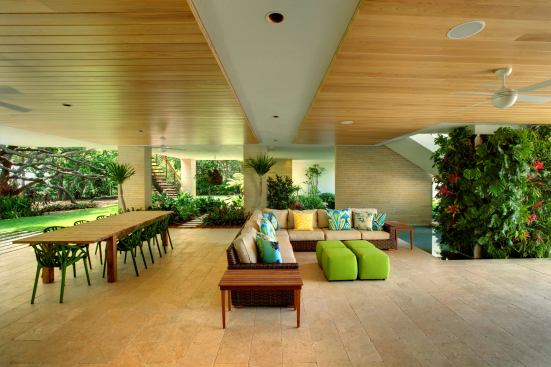 A covered terrace with outdoor dining accomplishes the owners’ goal of being “immersed in the landscape” of their Florida home. 
Project:
Osprey House, Osprey, Fla.; 
Architect: Sweet Sparkman Architects, Sarasota, Fla.; 
Builder: Michael K. Walker & Associates, Sarasota.