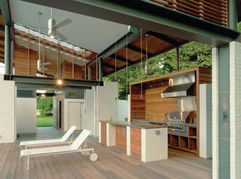 Topped by a thin copper roof supported by white brick piers, this open pool house has durable surfaces that ensure low-maintenance. The full kitchen includes a grill, sink, and lots of counter space for parties. 
Project: Rappahannock Bend Summer House, King George, Va.; Architect: McInturff Architects, Bethesda, Md.; Builder: Bonitt Builders, Alexandria, Va.