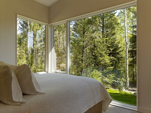 Corner windows bring views of the tranquil site into the bedrooms, making those space feel larger than they actually are.
