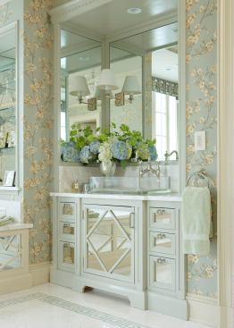 The bath is a deft melding of varied matierals and period details: Chinoiserie, turn-of-the-century, neoclassical, and contemporary.