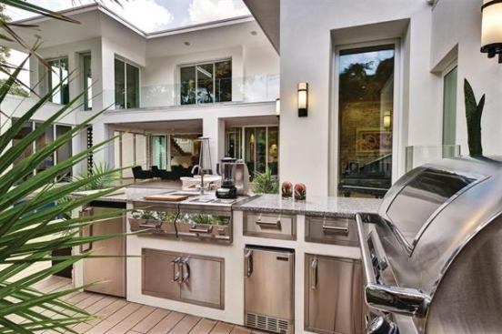 This open-air kitchen in the 2012 New American Home offers a full range of appliances, headlined by a barbeque with nearly 800 square inches of grilling space. 
Project: The New American Home 2012, Winter Park, Fla.; Builder/Architect: Phil Kean Design Build, Winter Park