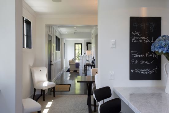 The kitchen is located at the back of the house, near the private backyard patio.