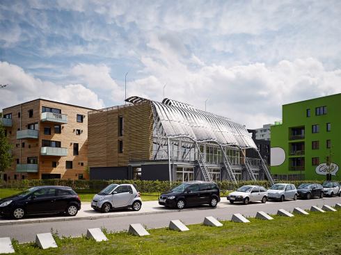 That working prototype, completed in March 2013, is a set of four live/work row houses that feature the firm’s textile solar cells while also meeting Passive House standards.