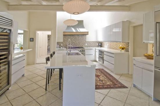 In the remodel of this 1960s post-and-beam house originally designed by Cliff May, the goal was to preserve May’s original vision. “His focus was always on light and air,” says Barry Berkus, who led the remodel. To that end, the kitchen was outfitted with glossy white cabinets that reflect and amplify the natural lighting and add an airy feel. Project: Oxbow Residence, Solvang, Calif.; Builder: Randy Barnes, Santa Barbara, Calif.; Architect: B3 Architects, a Berkus Design Studio, Santa Barbara
