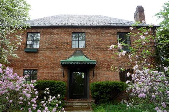 Before: As part of the renovation, the home's existing facade was restored and a new entryway built.