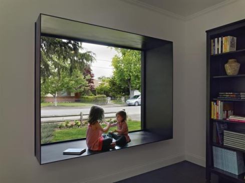 A street-facing picture window on the front of this midcentury home remodel gets a contemporary upgrade with a protruding steel frame to incorporate seating.  Residential Architect, March-April 2012  
Bal House, Menlo Park, Calif.  Terry & Terry Architecture, Berkeley, Calif.