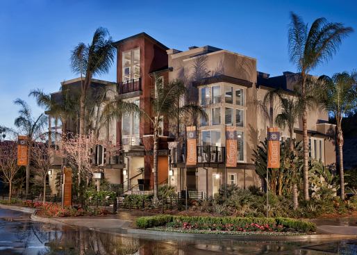 Grand, Multi-Family Housing Project - 18 to 30 du/acre (For Sale or Rent). Builder: Shea Homes. Architect: Woodley Architectural Group Inc. Located in a suburban San Diego neighborhood, these townhouses deliver modern, urban aesthetics for young couples or families.