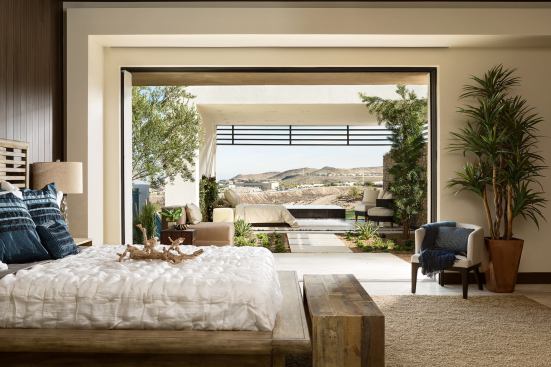 Breathtaking views of the surrounding landscape are visible from one of the home's bedrooms.