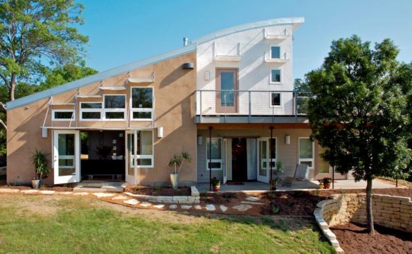 Heather’s Home is the first LEED-H Platinum home in Texas and the third in the nation. The SIP-built house features solar hot water, rainwater collection, and a standing seam metal roof.