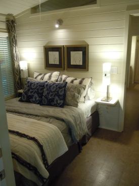 The master bedroom walls, like the other parts of the house, can be clad with tongue-and-groove beadboard or gypsum.