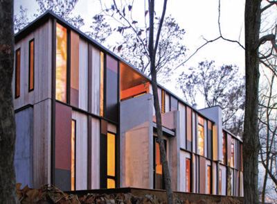 There is more than one way to do a site-specific building. You can go with the one-with-nature approach or the contrast-to-nature approach. Or you can do a little of both. Johnsen Schmaling Architects made this vacation home modern but used the bark of the trees, the foliage, and the hillside to inform its design decisions.